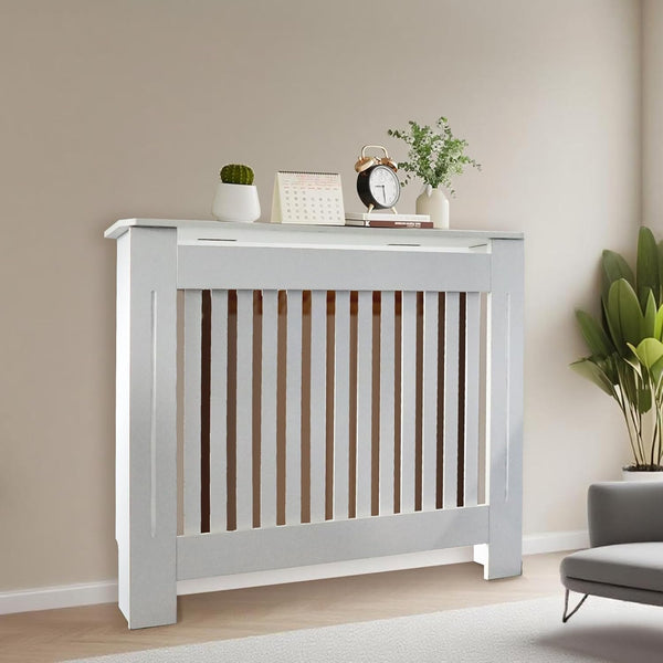White radiator cover with decorative items in a living room setting