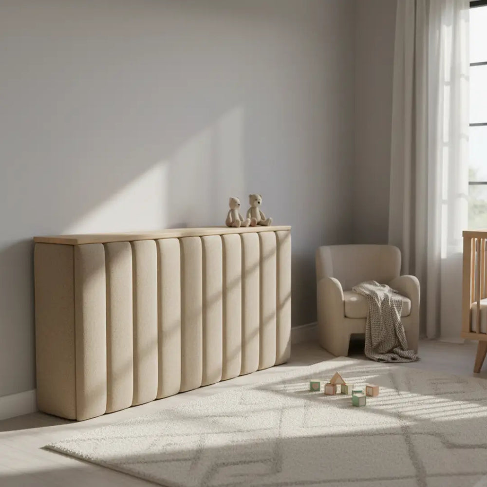 Beige console table against a wall with a chair and window in the background