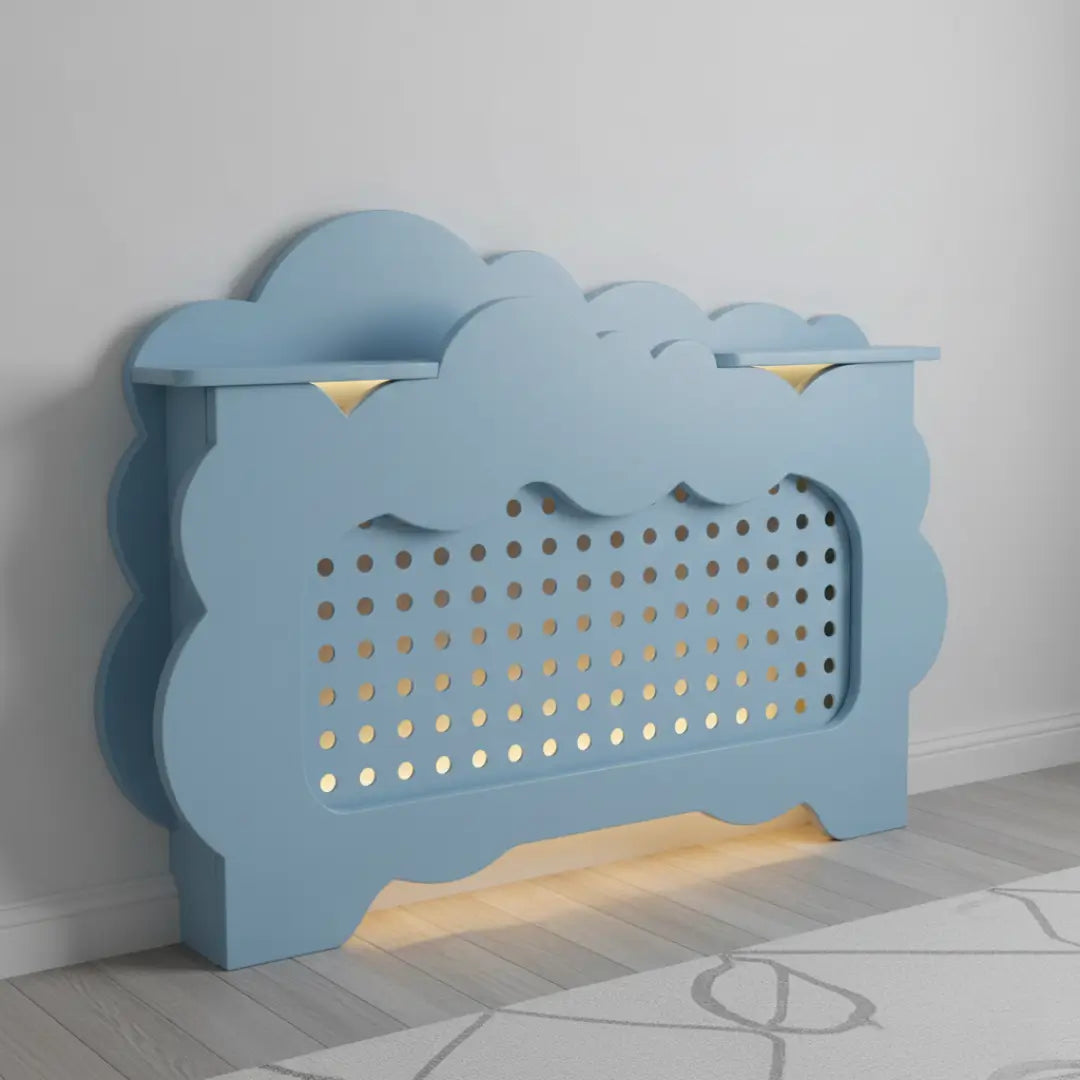 Blue decorative radiator cover with cloud design on a gray wall.