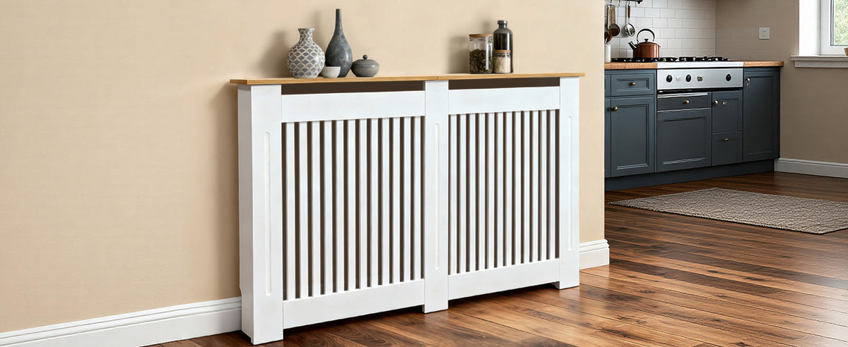 White radiator cover in a kitchen setting with wooden flooring and beige walls.